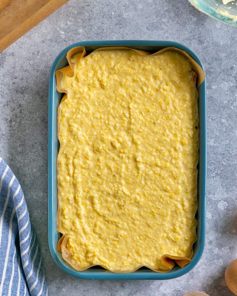 Transferring cornbread mix to baking dish