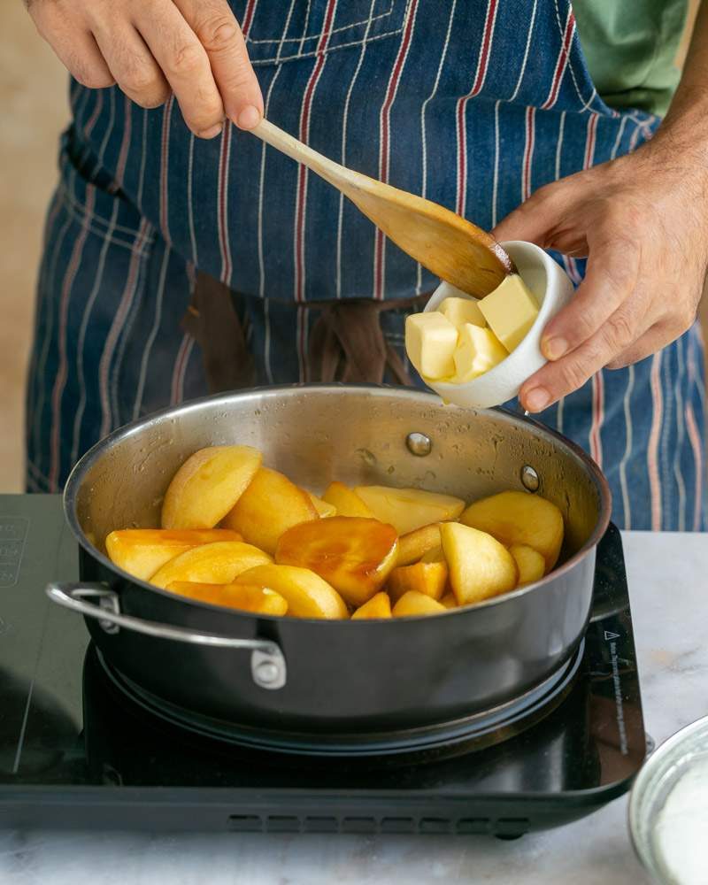 adding butter to caramel sauce