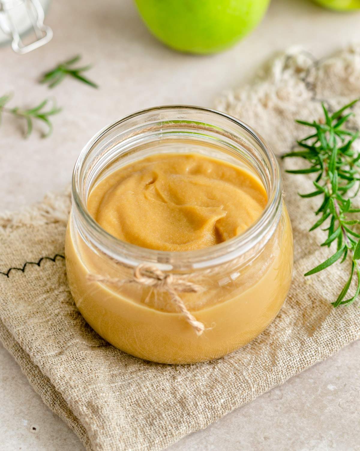 Apple caramel sauce in a glass jar