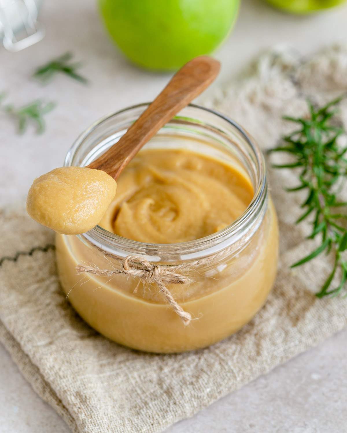 Apple caramel sauce in a spoon