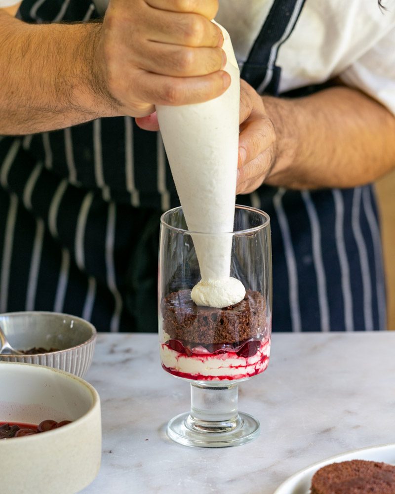 Assembling the second layer with whipped cream