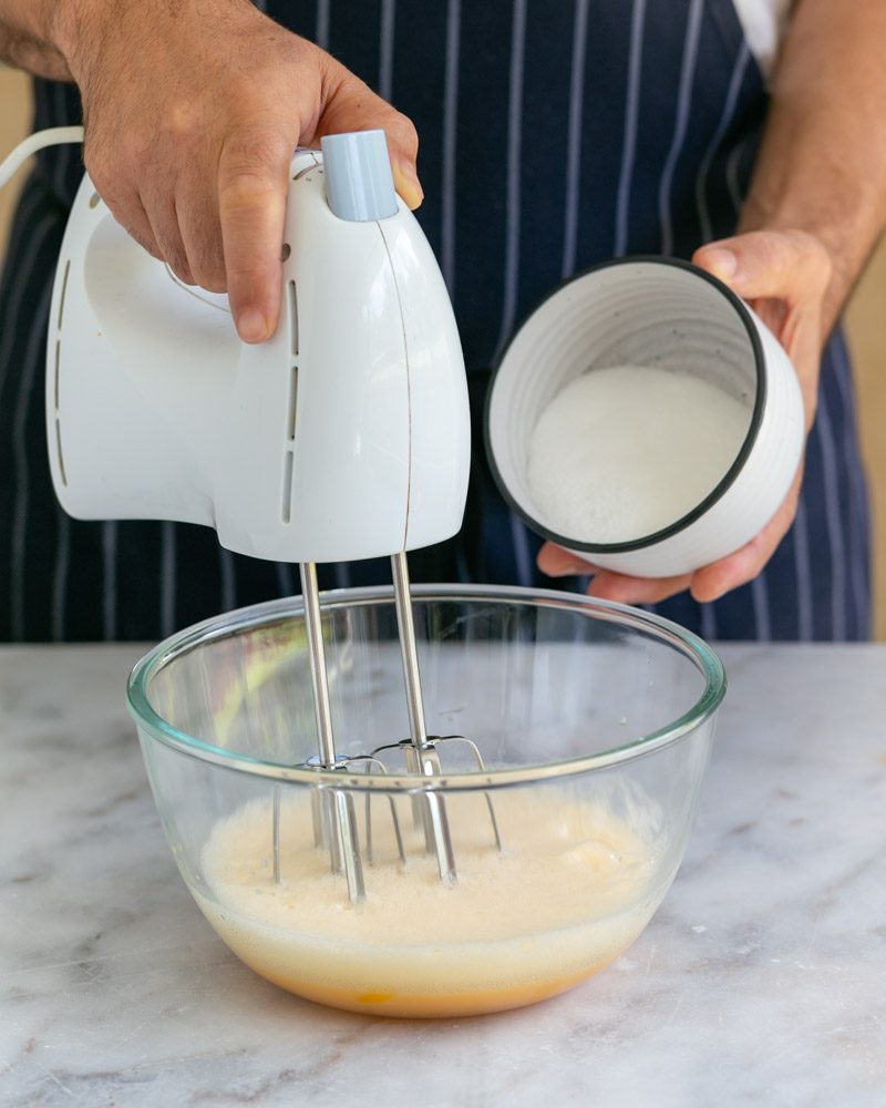 Beating eggs & sugar in a bowl