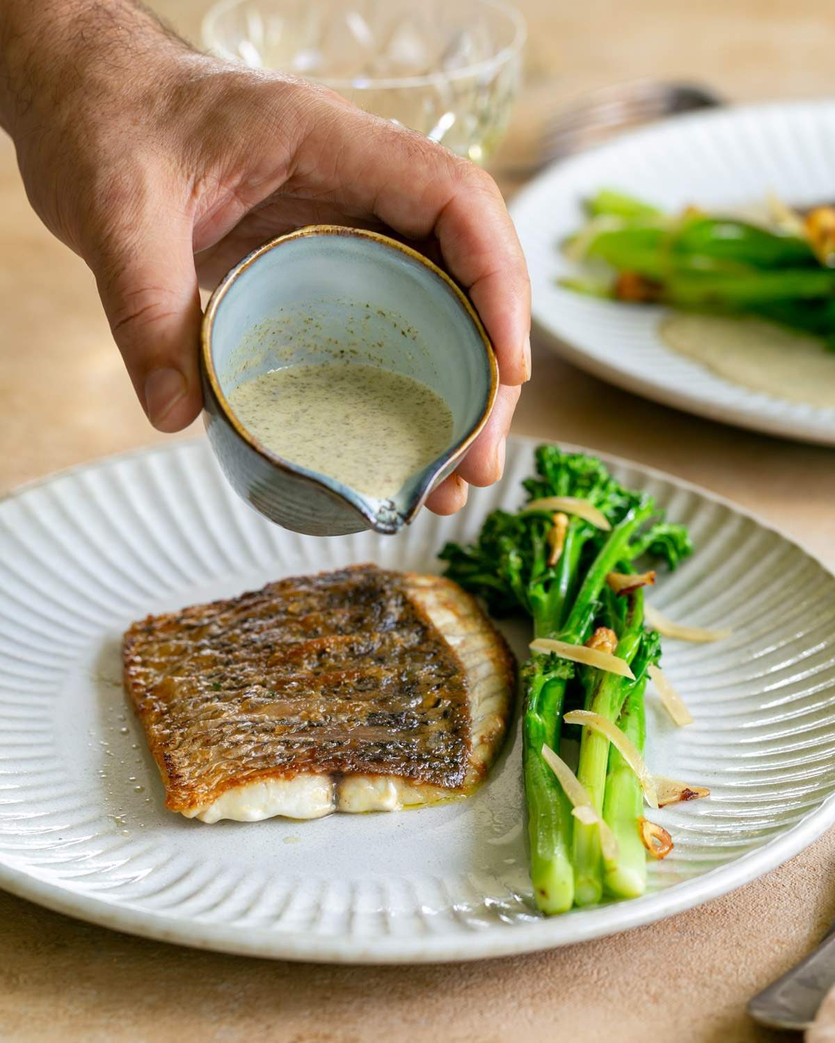 Seaweed butter sauce with pan fried barramundi