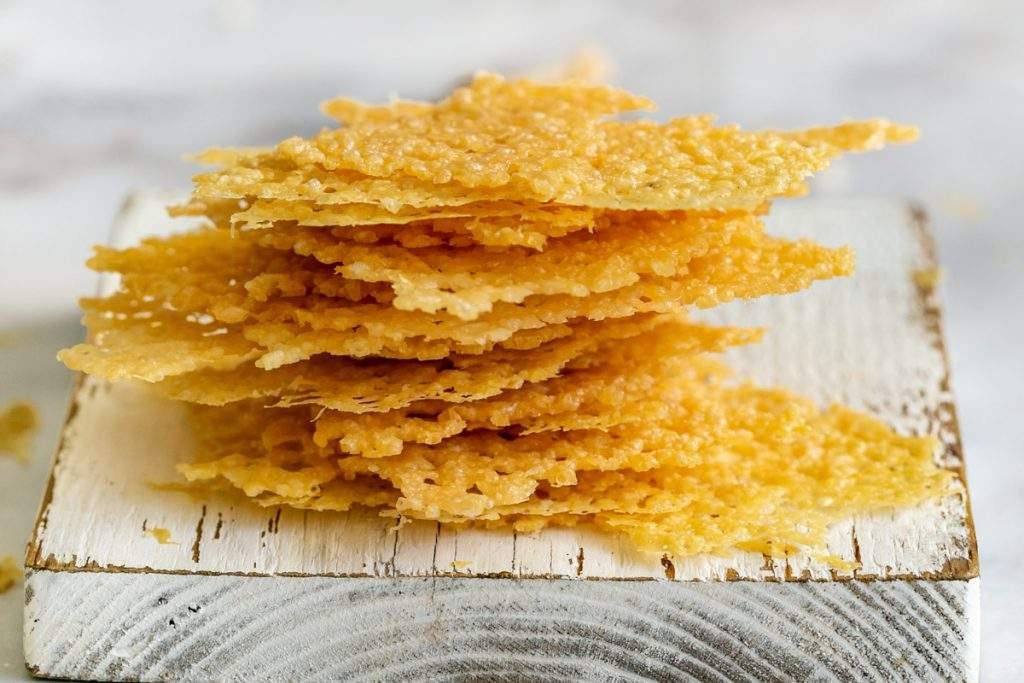 Stack of broken parmesan crisp pieces