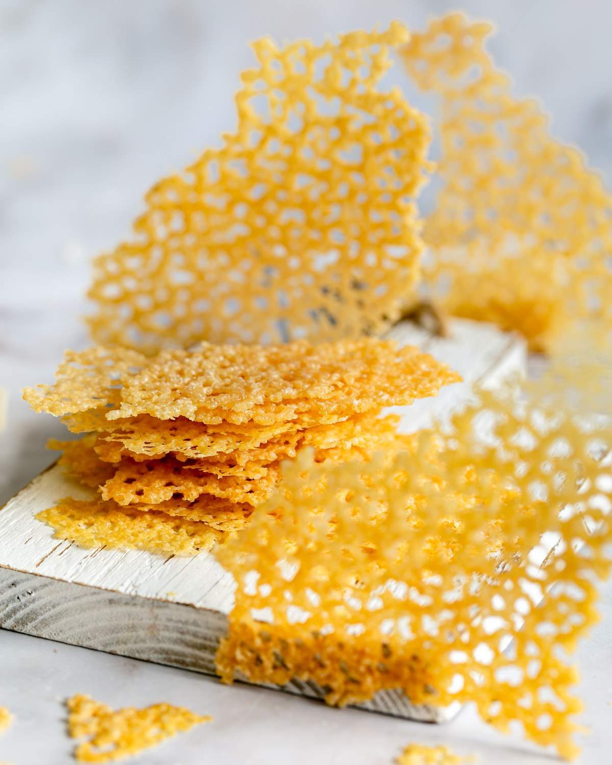 Parmesan cheese crisps broken into smaller pieces