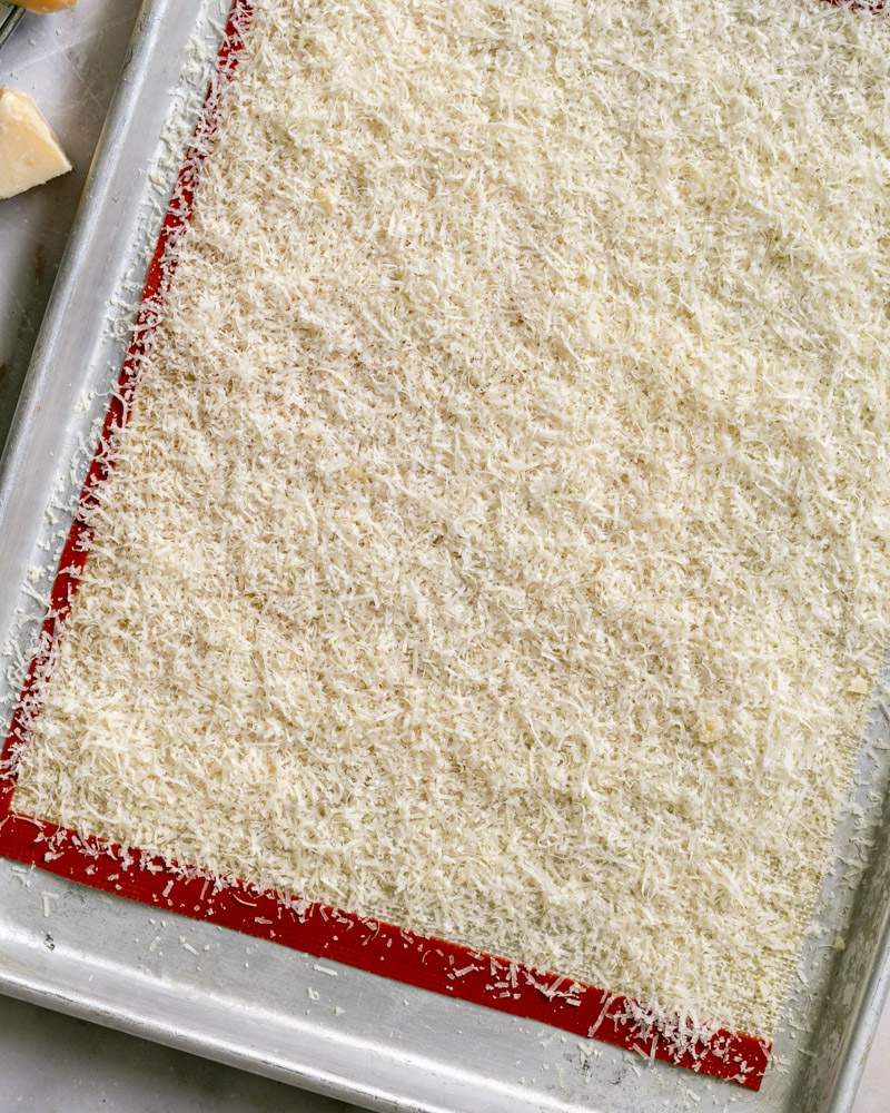 Grated parmesan cheese on baking mat
