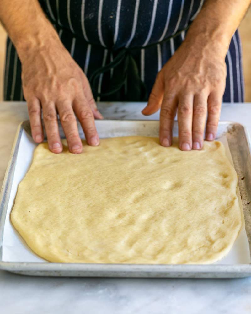 Rolled out dough on baking tray resting