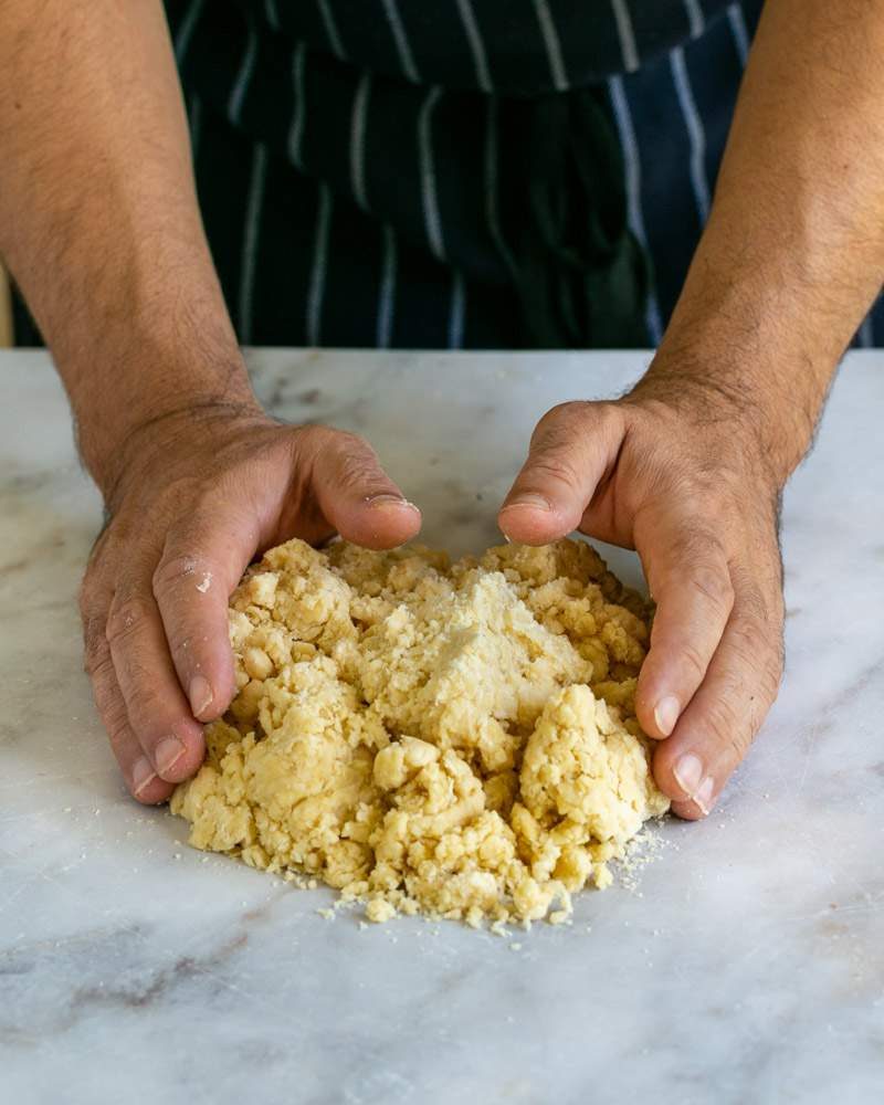 bringing the dough together using hands