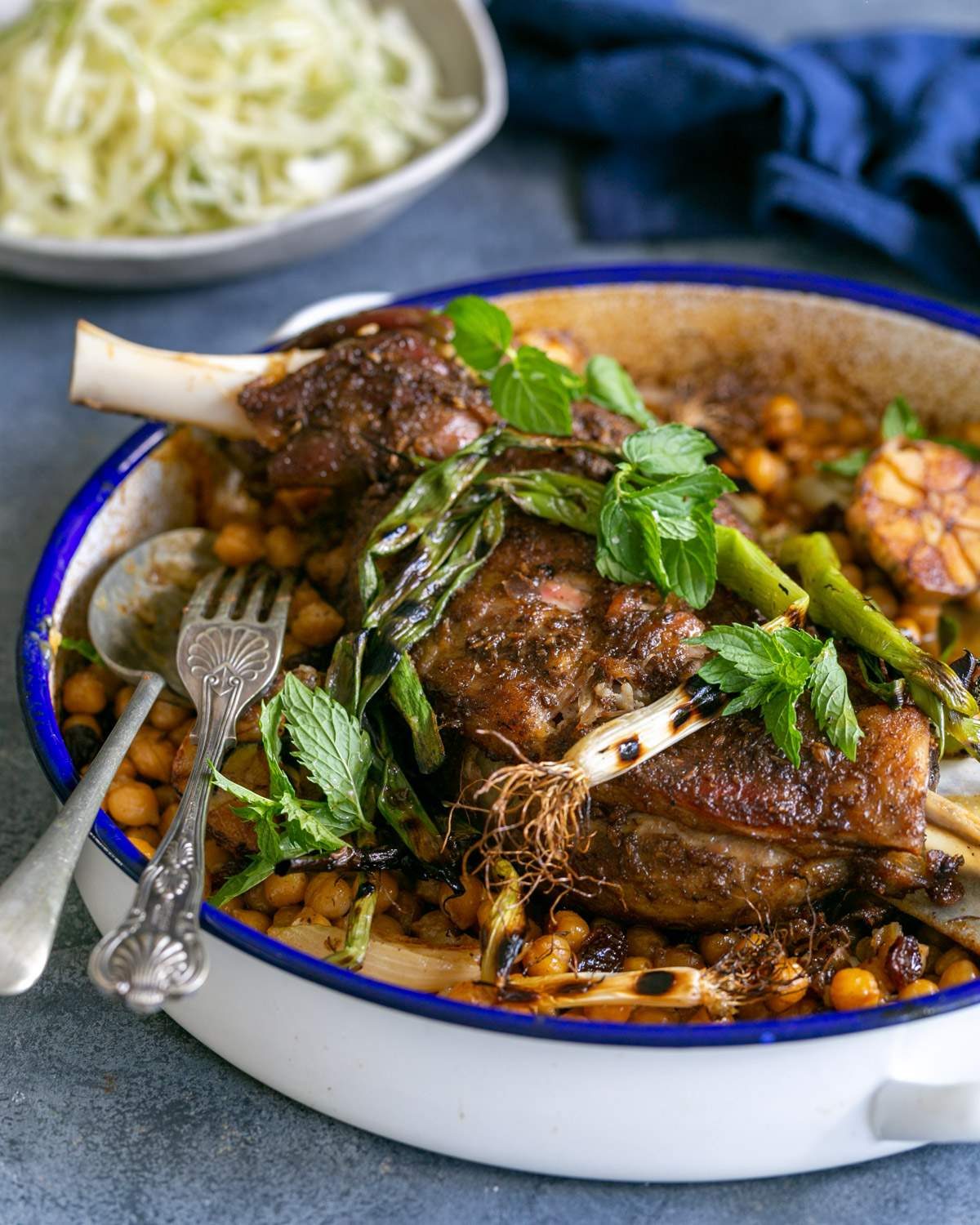 Slow roasted lamb shoulder served with chickpeas and fennel salad