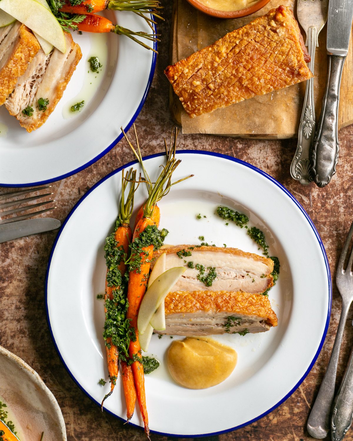 Crispy pork belly with roasted carrots and apple sauce