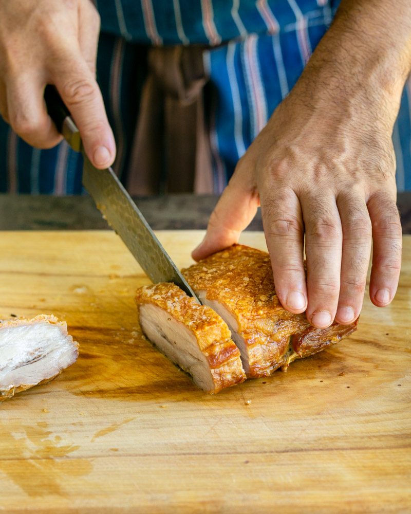 Carving the roast pork belly