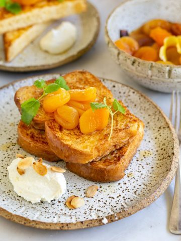 two slices of french toast with apricots and ricotta