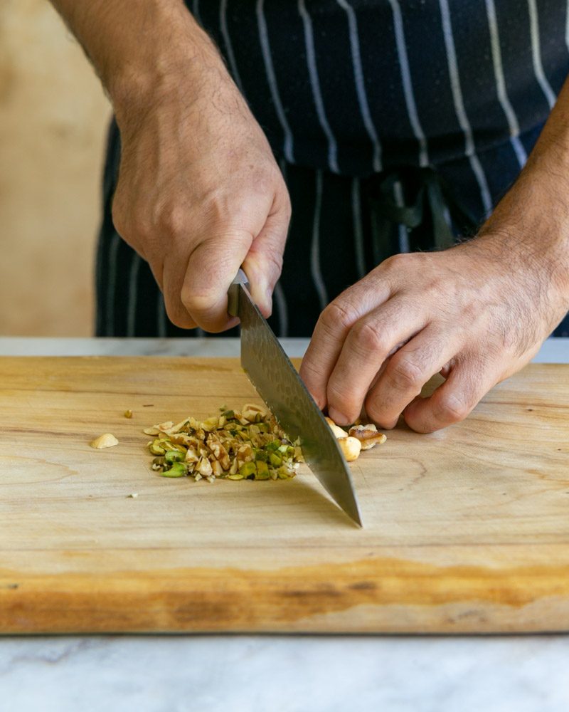 Chopping nuts to stuff cheese