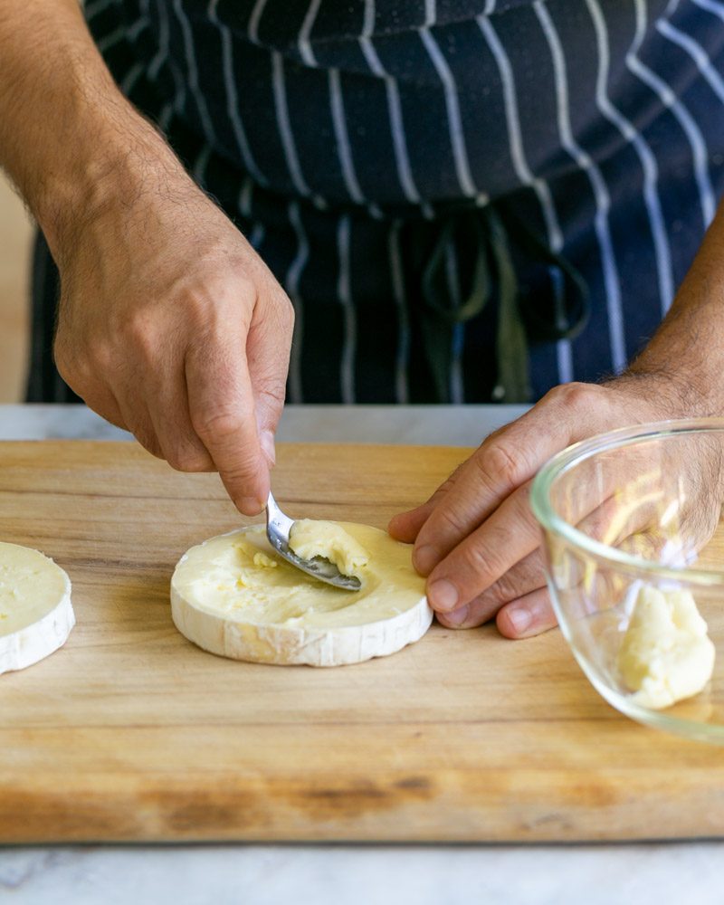 Scooping cheese with a spoon