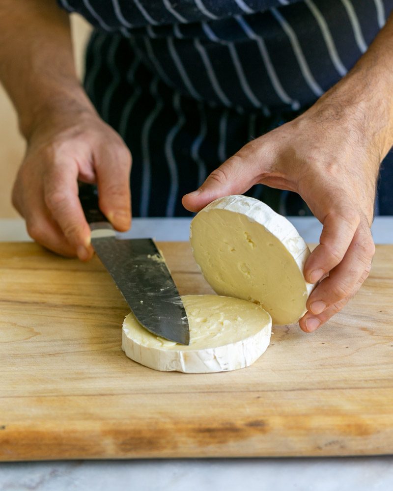 Brie cheese cut into two halves