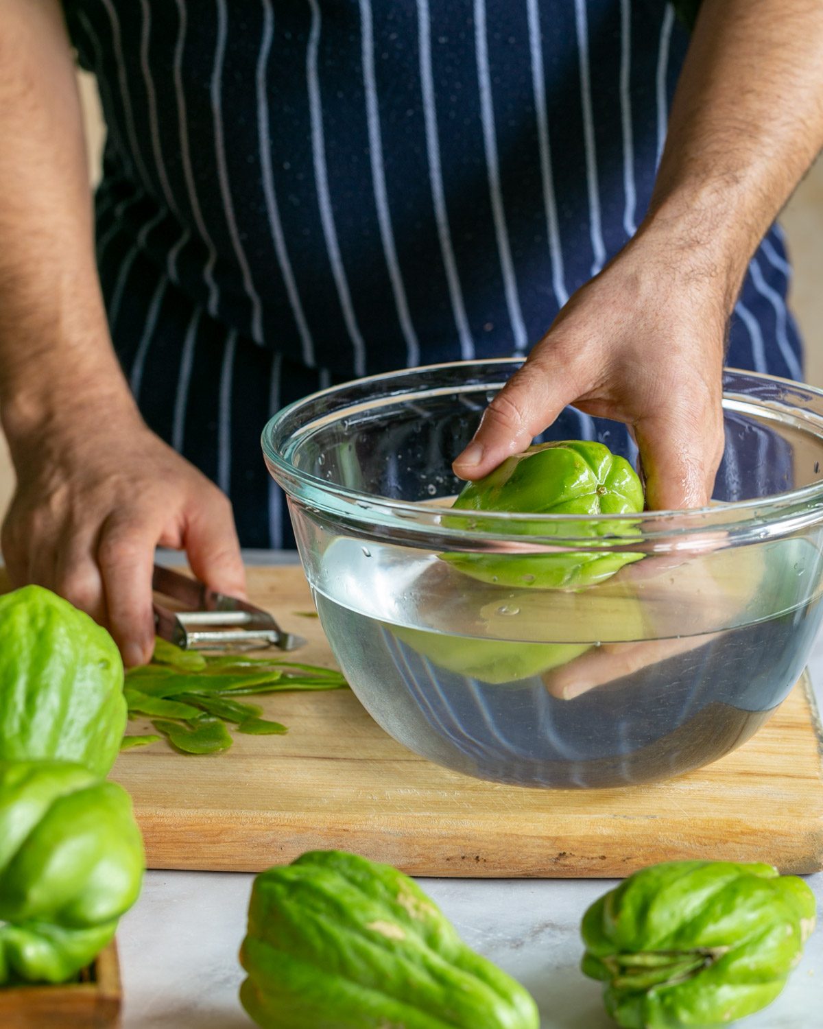 Peeling choko vegetable