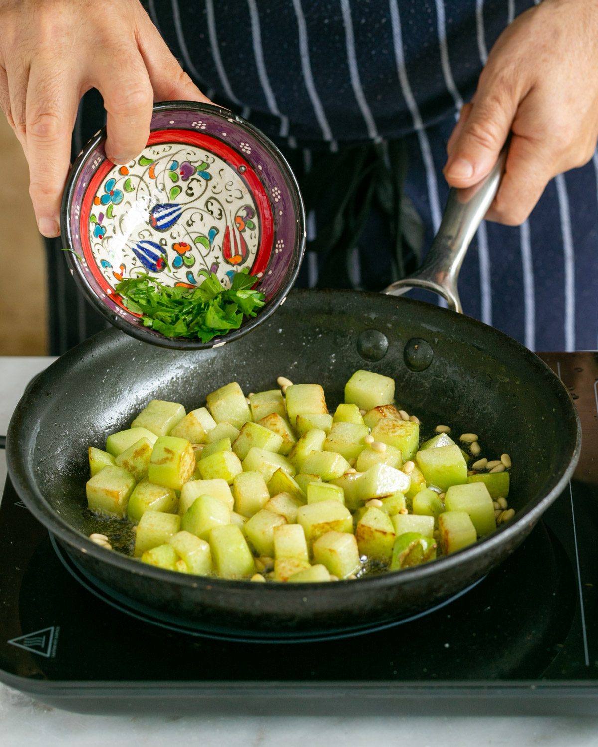 Adding parsley to cooked choko