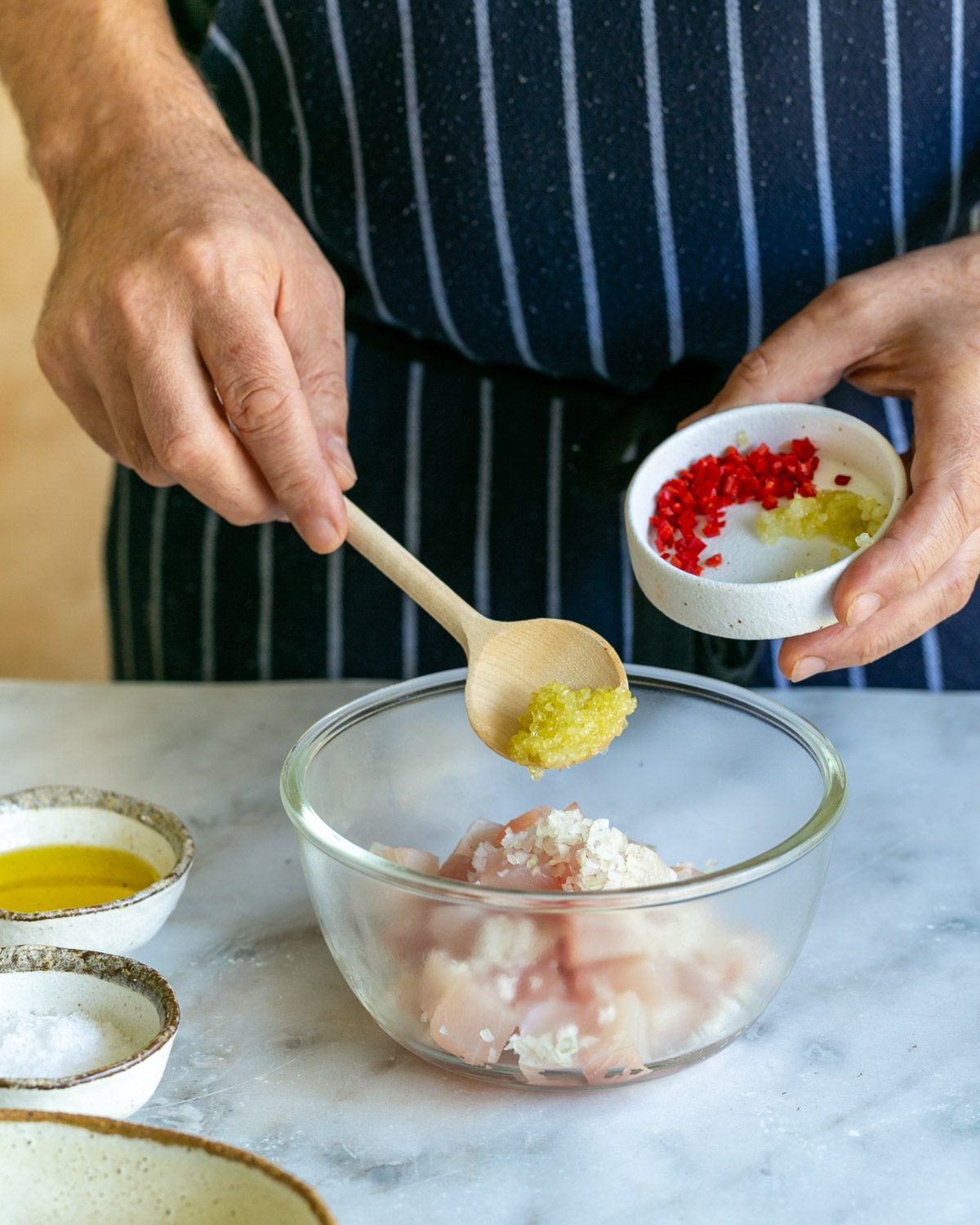 Mixing ingredients to make crudo