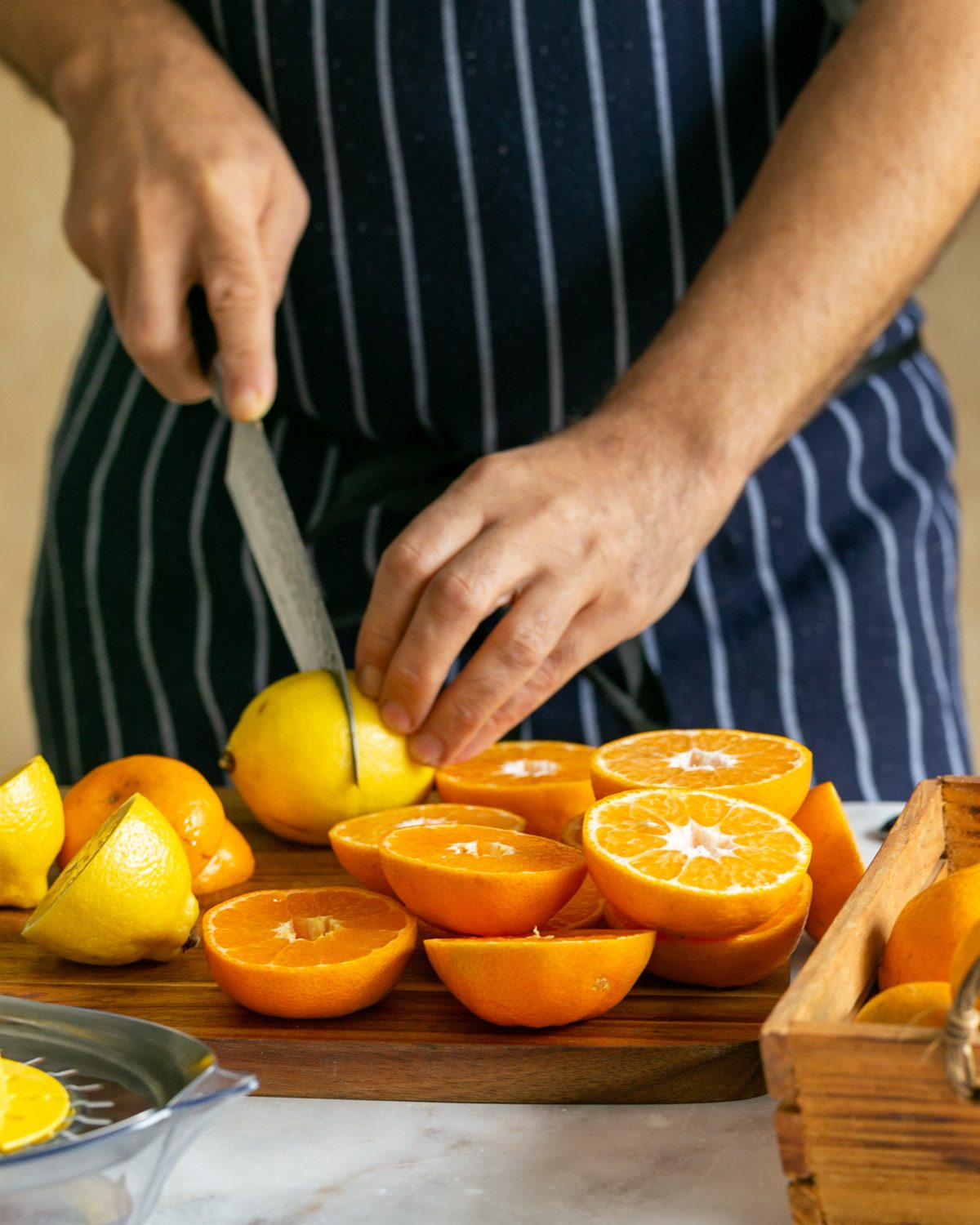 Mandarin and lemons cut in half to juice