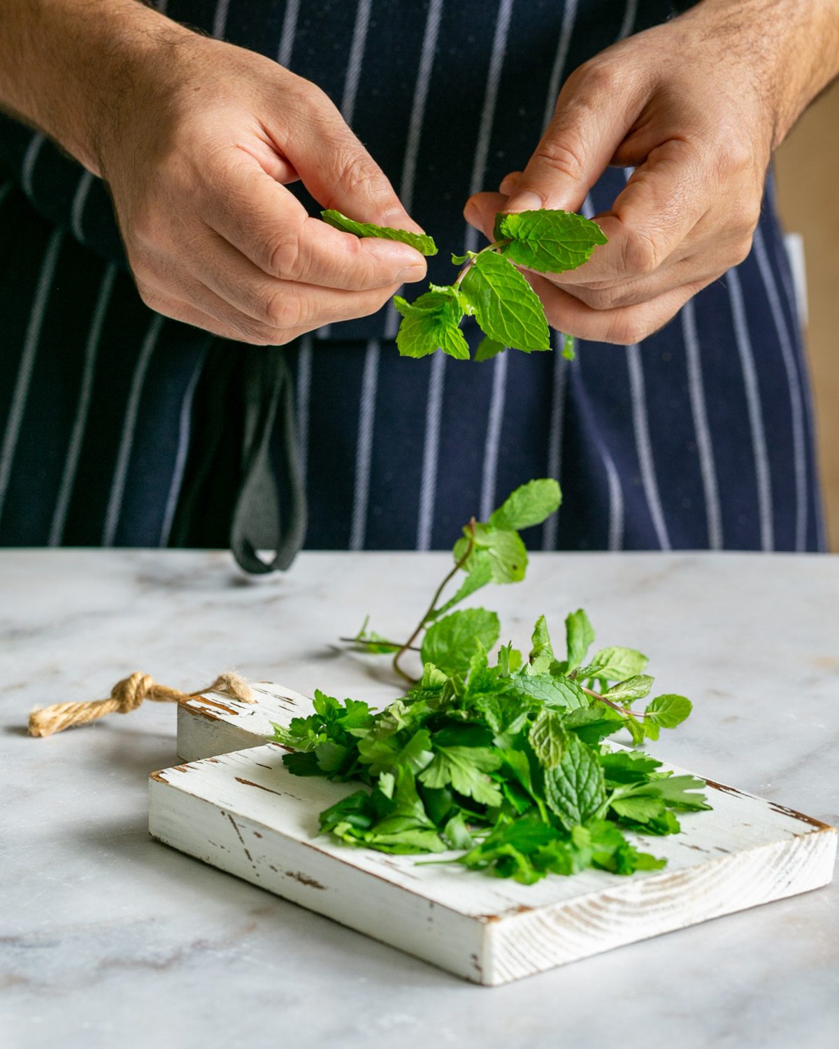 Picking mint and parsley leaves