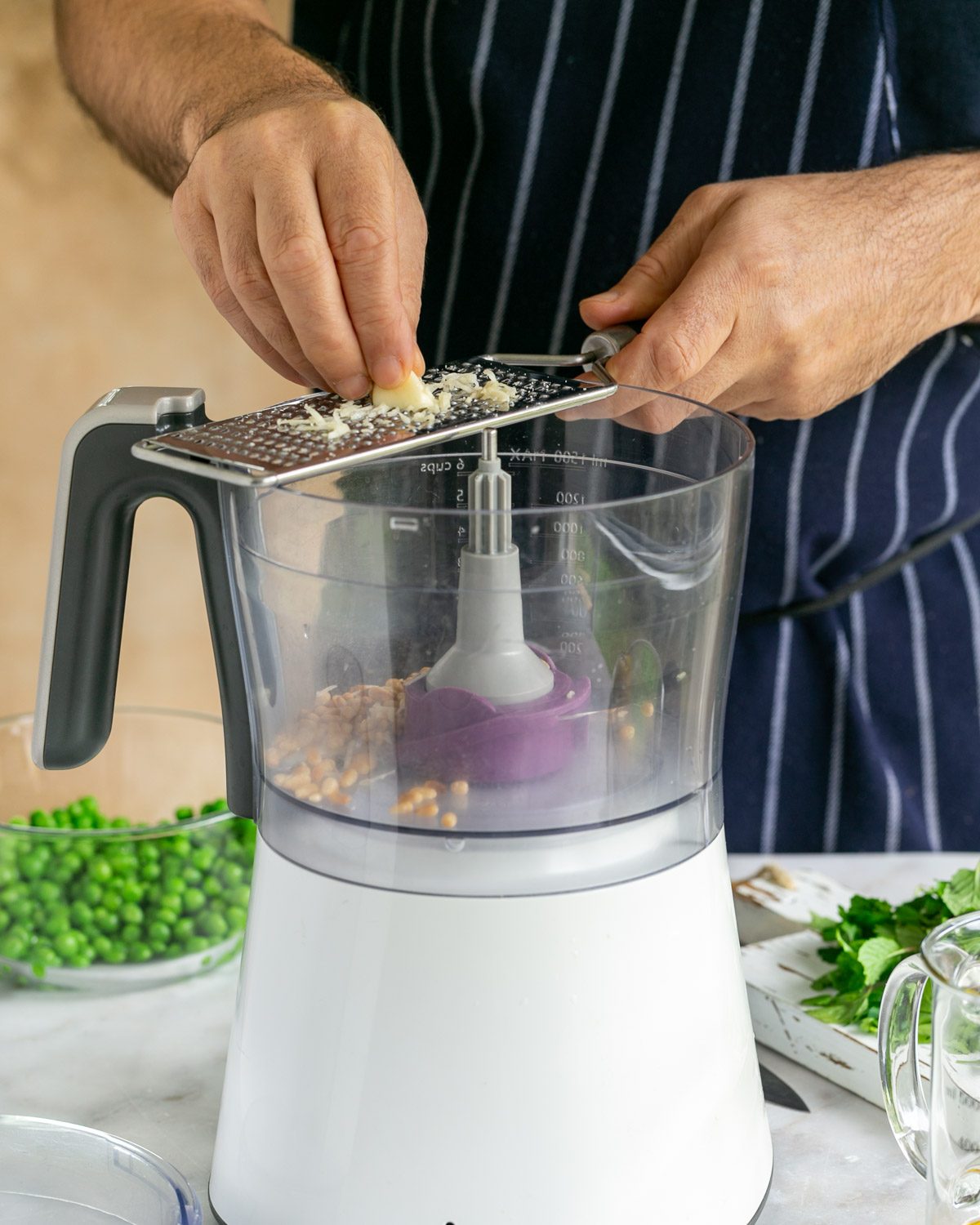 Grate garlic unto the food processor