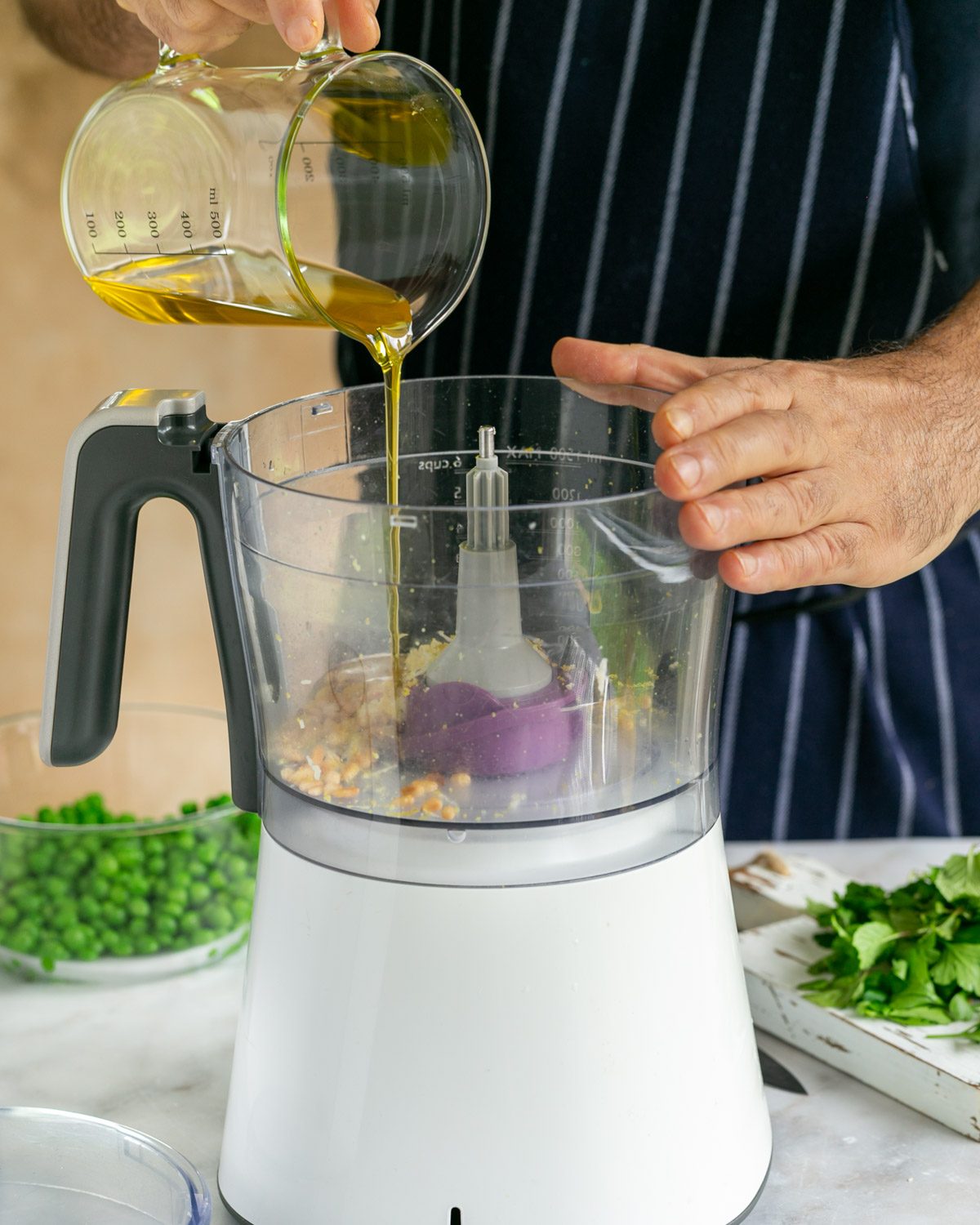 Pour the olive oil into the food processor