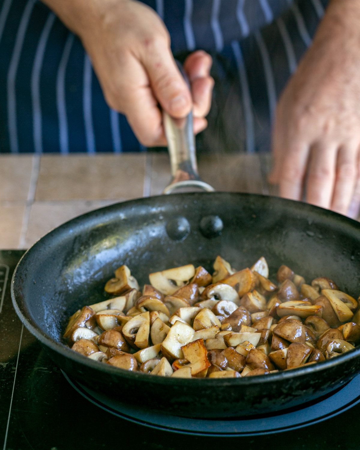 Roasting mushrooms in a pan