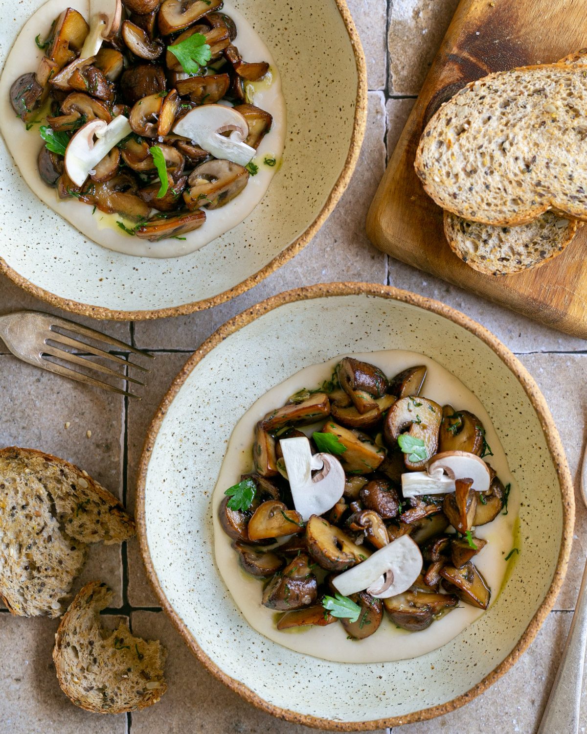 Roasted mushrooms served on canneli beans hummus