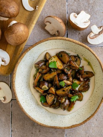 Roasted chestnut mushrooms plated in a bowl