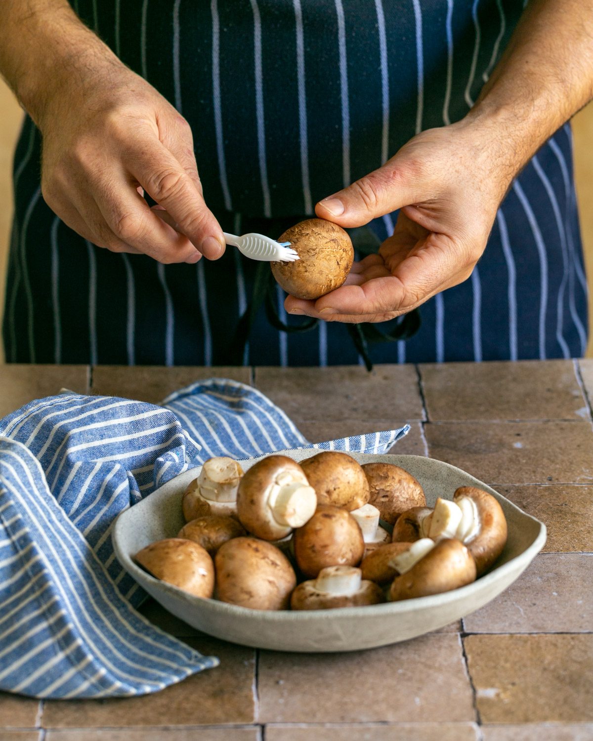 Cleaning chestnut mushrooms with a toothbrush