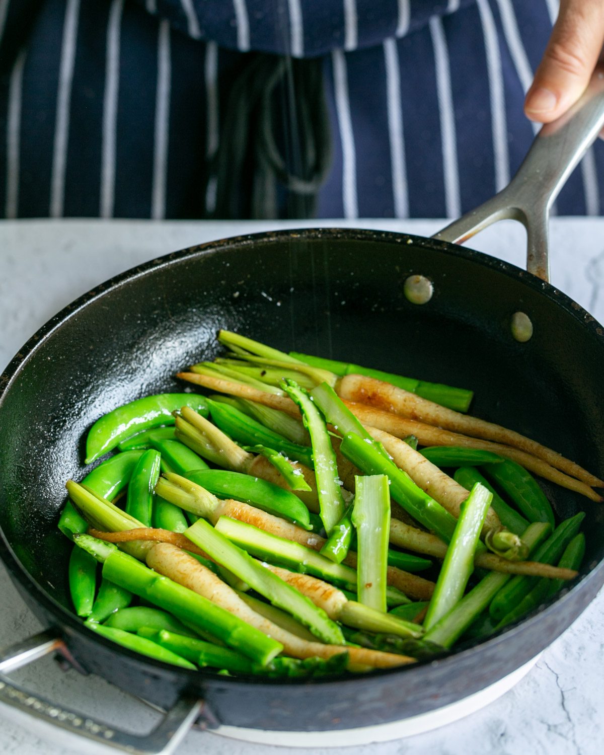 Pan roast blanched peas and asparagus