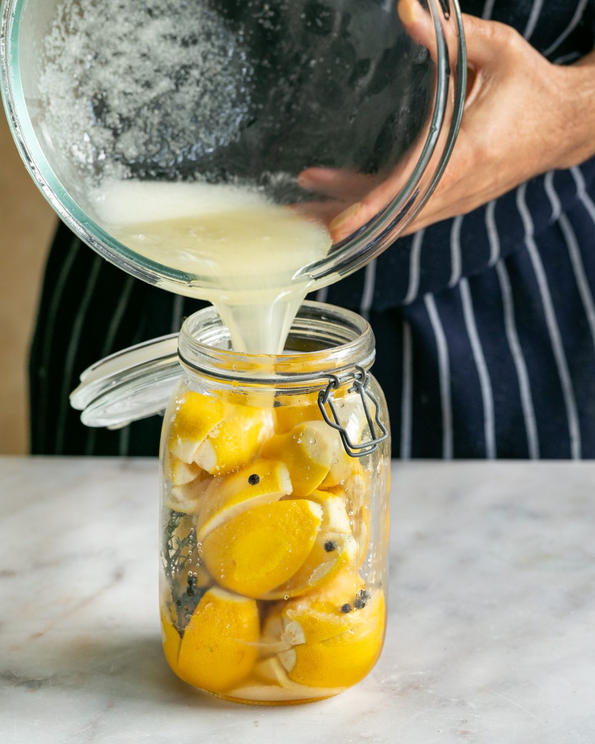 Adding salt and sugar water to the jar