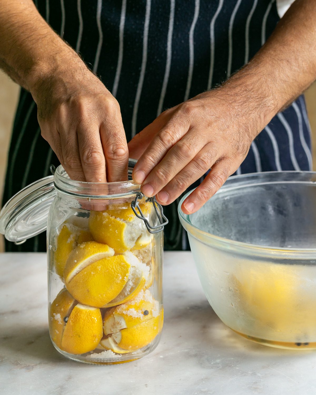 Adding lemons to a jar