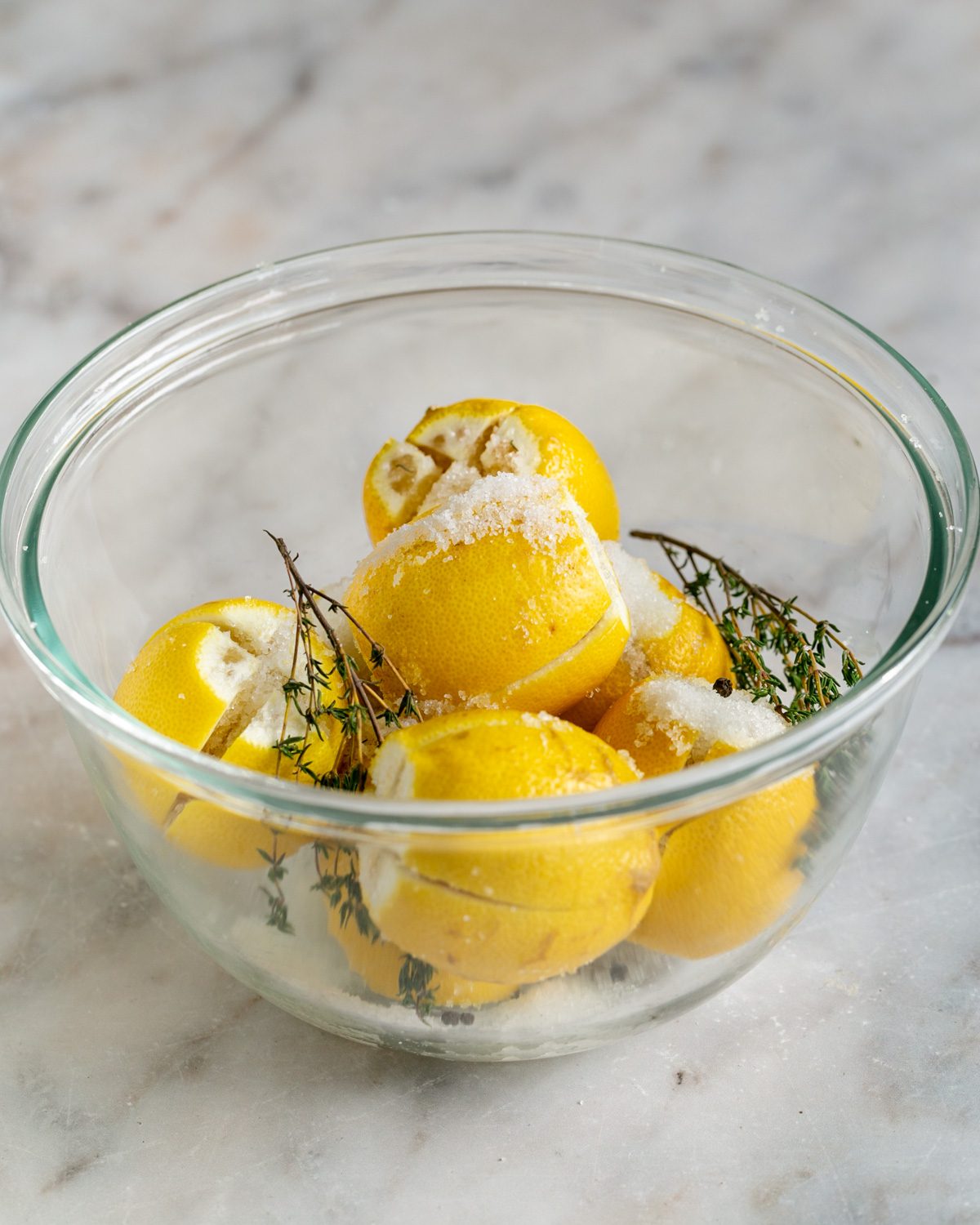 Lemons with salt and sugar mixture in a bowl