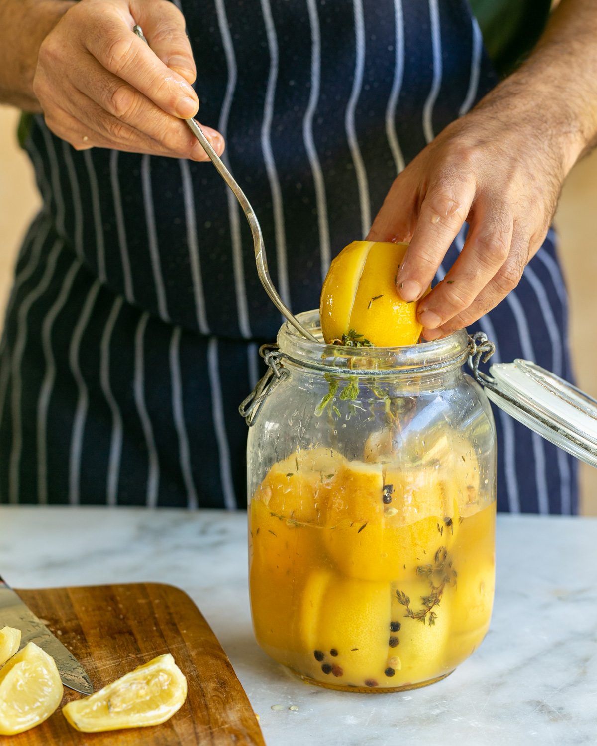 Taking out preserved lemons from the jar