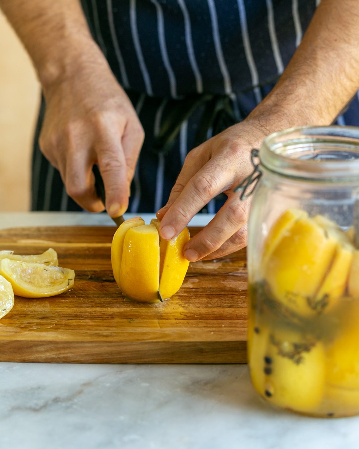 Cutting the preserved lemon in wedges