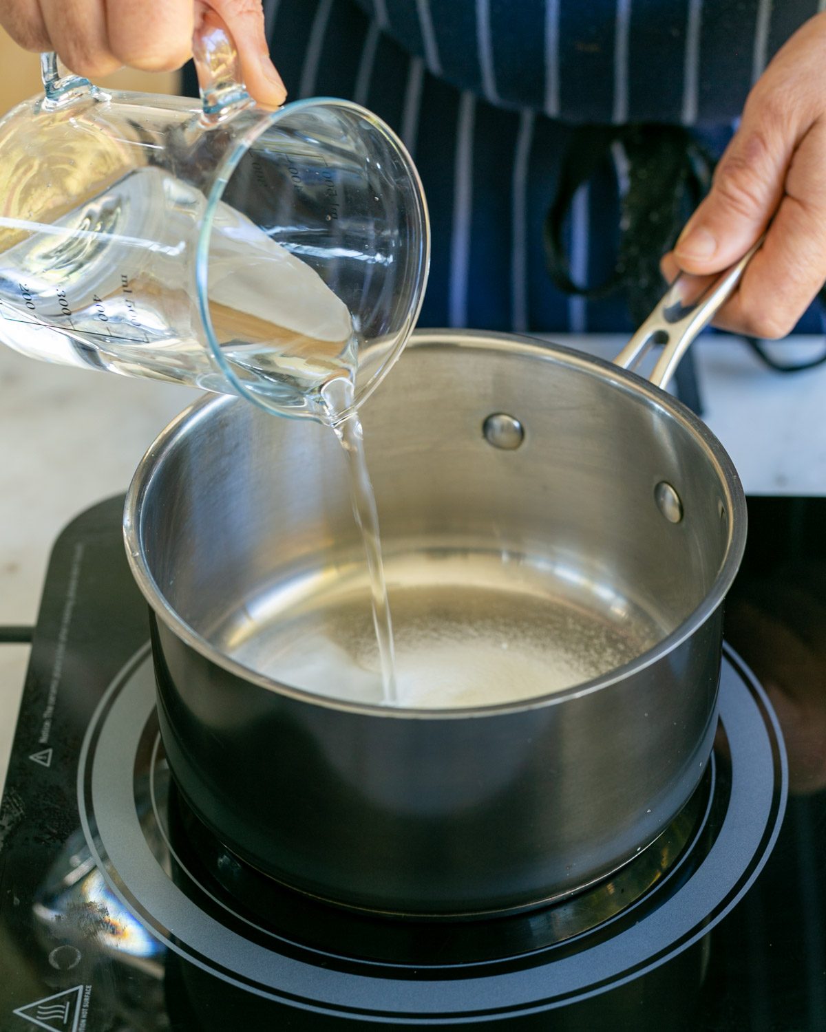 Sugar and water in a pot