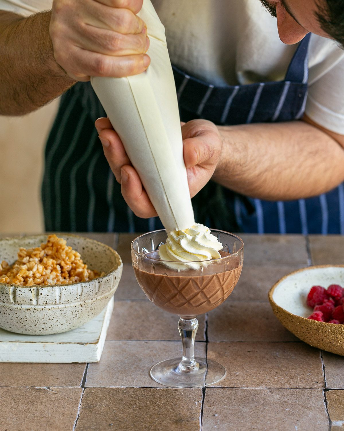 decorating the dessert with whipped cream