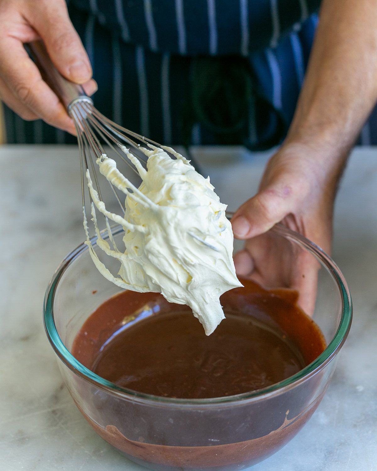folding whipped cream in melted chocolate
