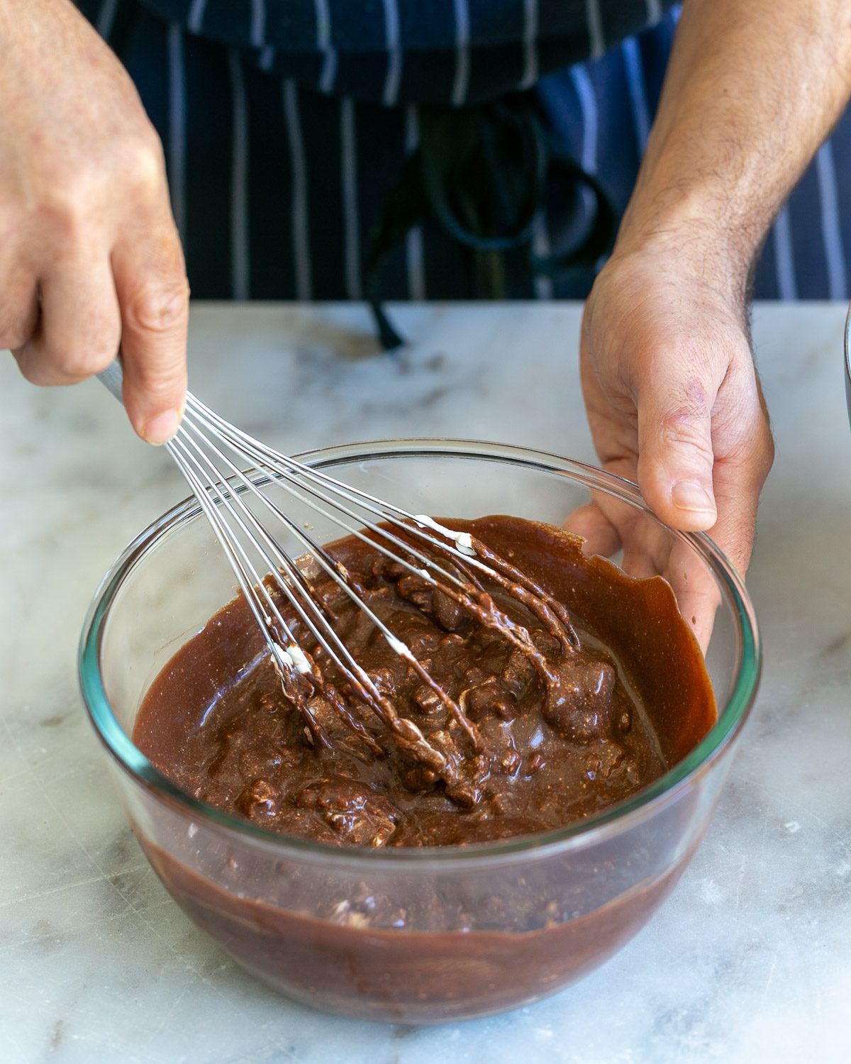 Folding whipped cream into melted chocolate