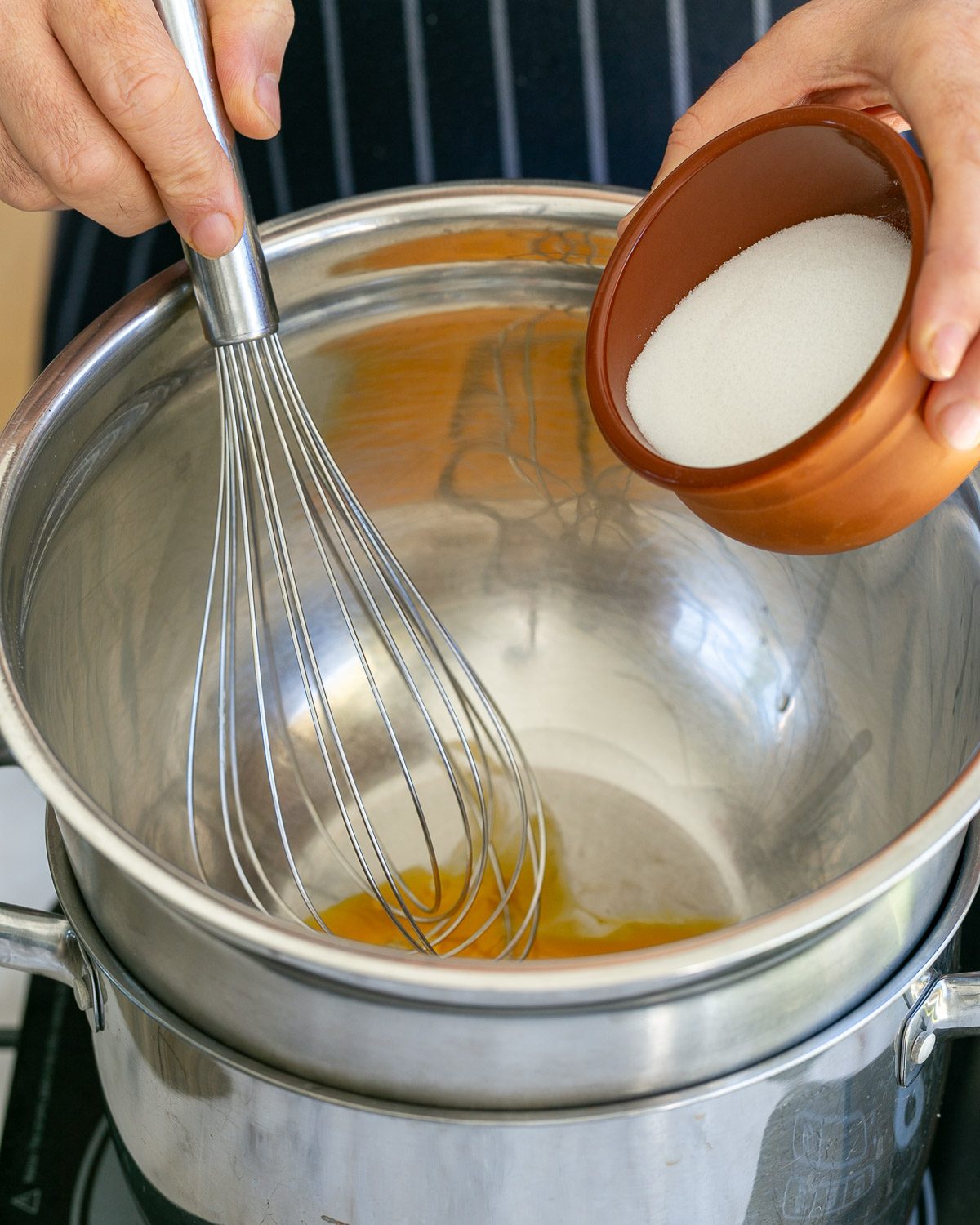 Adding sugar to egg yolks