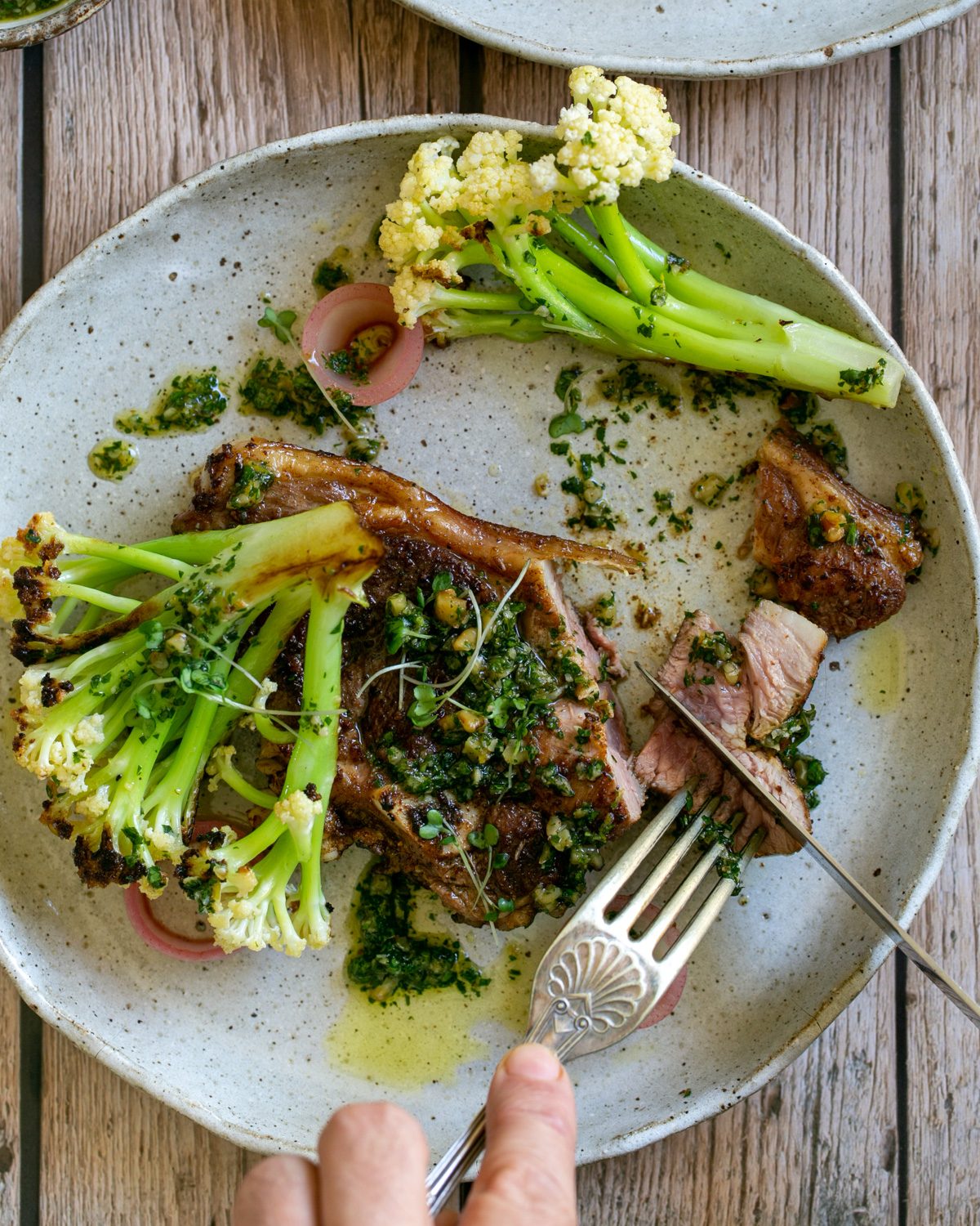 Eating lamb chops with form and knife