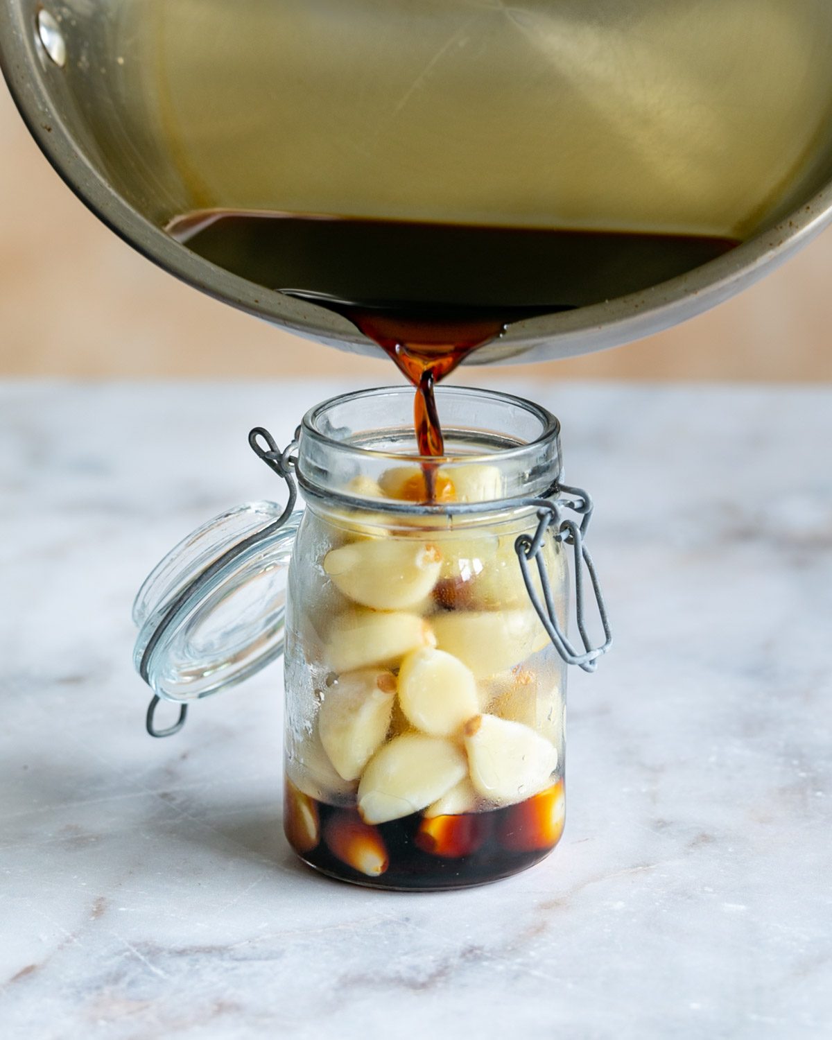 Pouring the soy liquid in the jar