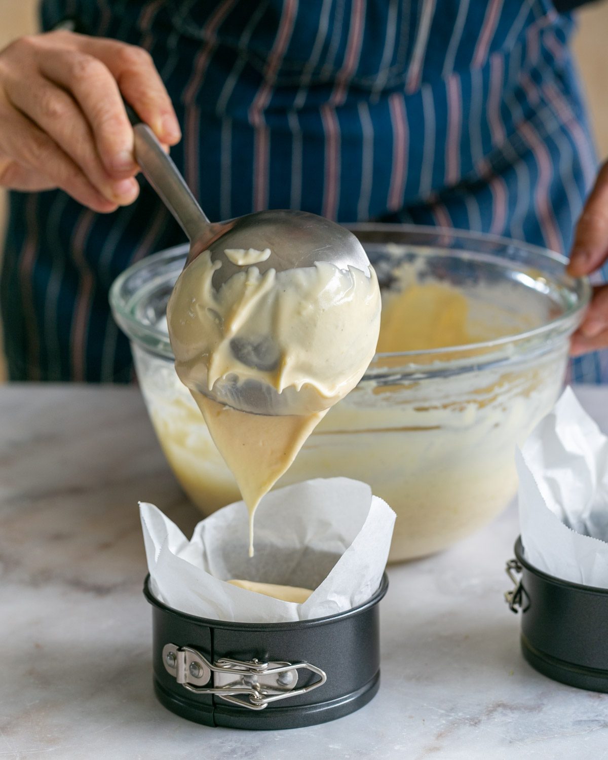 Pouring batter into mini spring forms