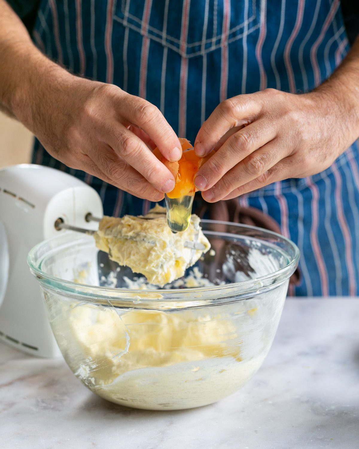 Adding eggs to cheesecake batter