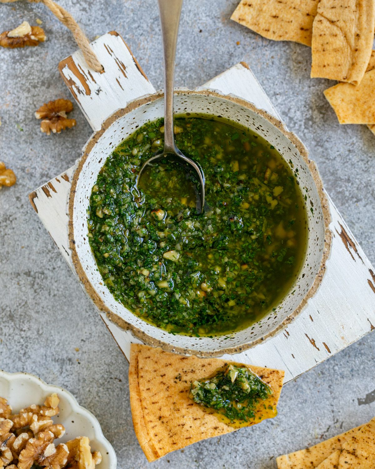 Walnut Lemon Gremolata in a bowl with crackers on the side