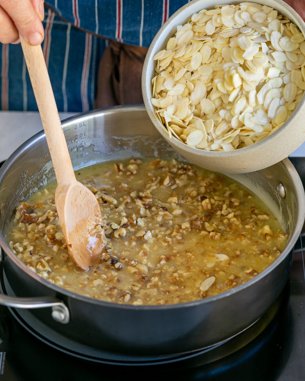 Adding nuts to the pan