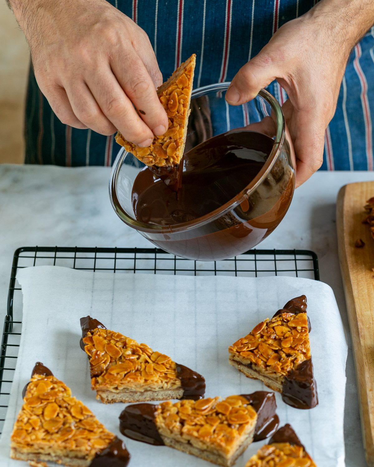 Dipping nussecken corners in melted chocolate