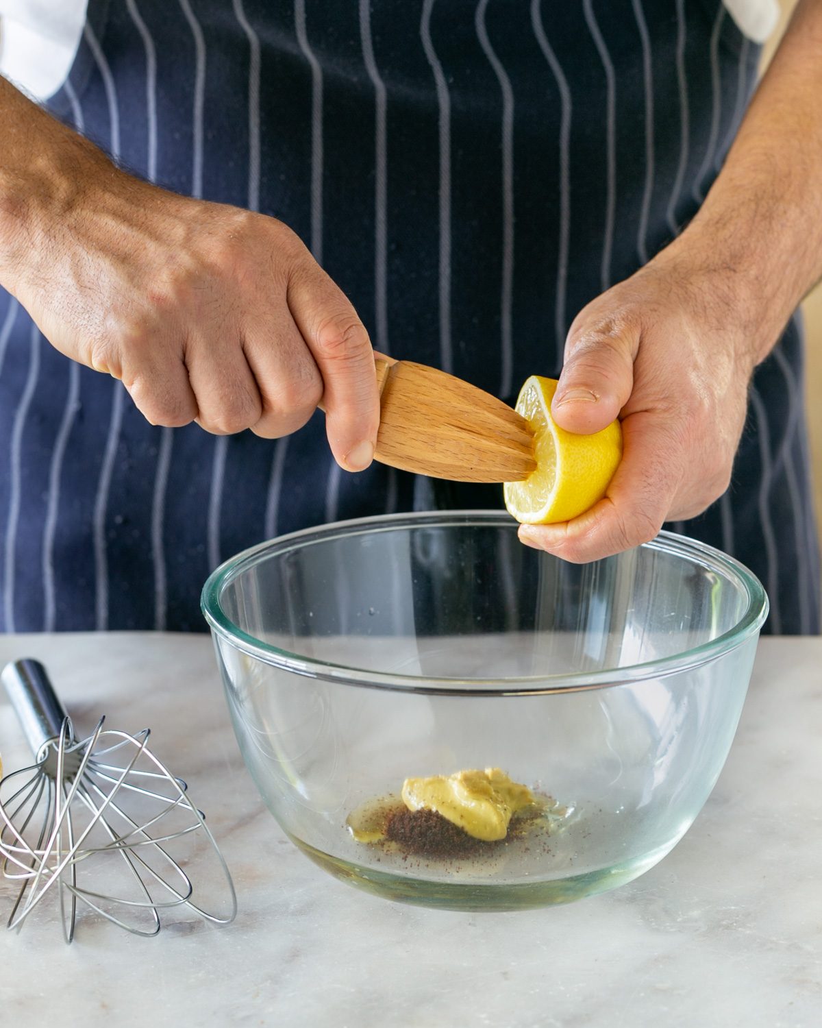 Adding lemon to sumac dressing