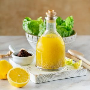 Sumac dressing in a glass bottle